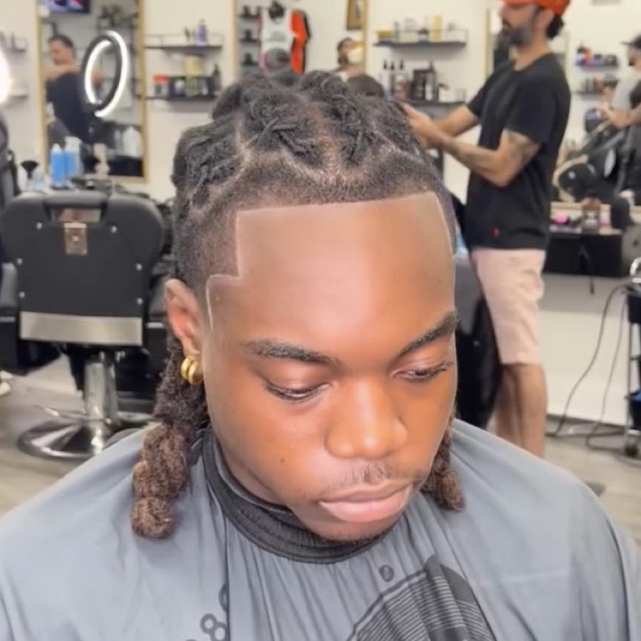 Locs pulled back with a sharp square lineup