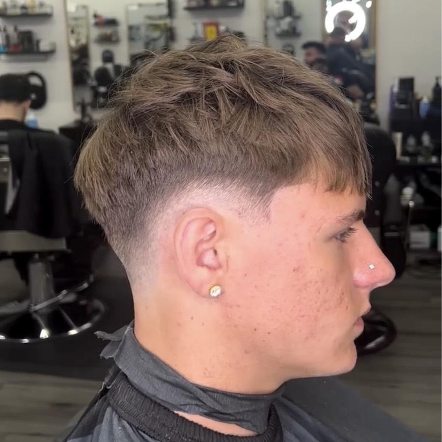 Light textured crop with a low taper fade