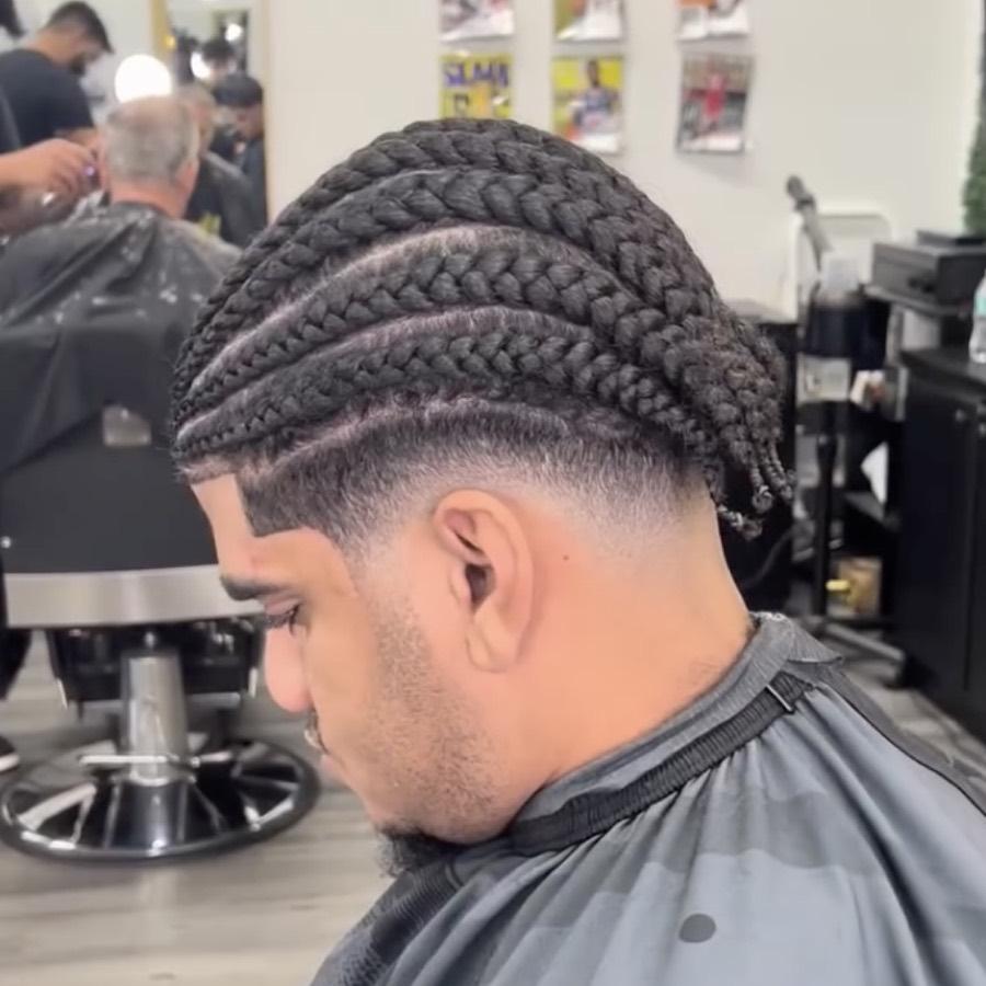 Cornrows with a taper fade and lineup