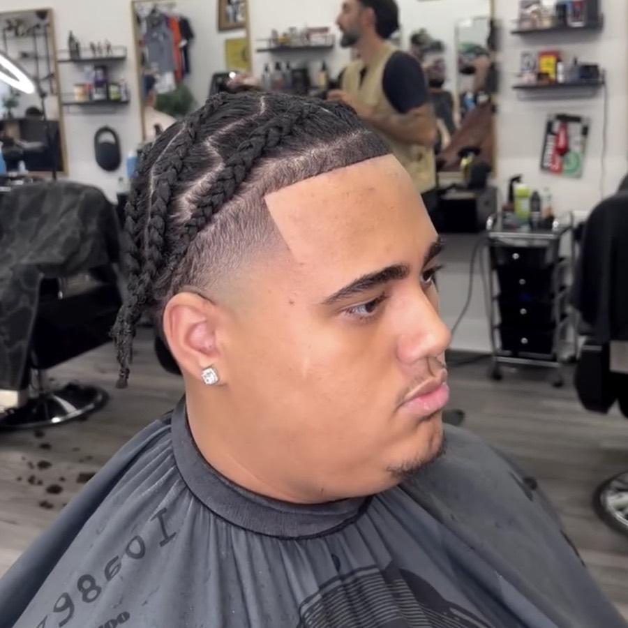 Braids with a mid fade and lineup